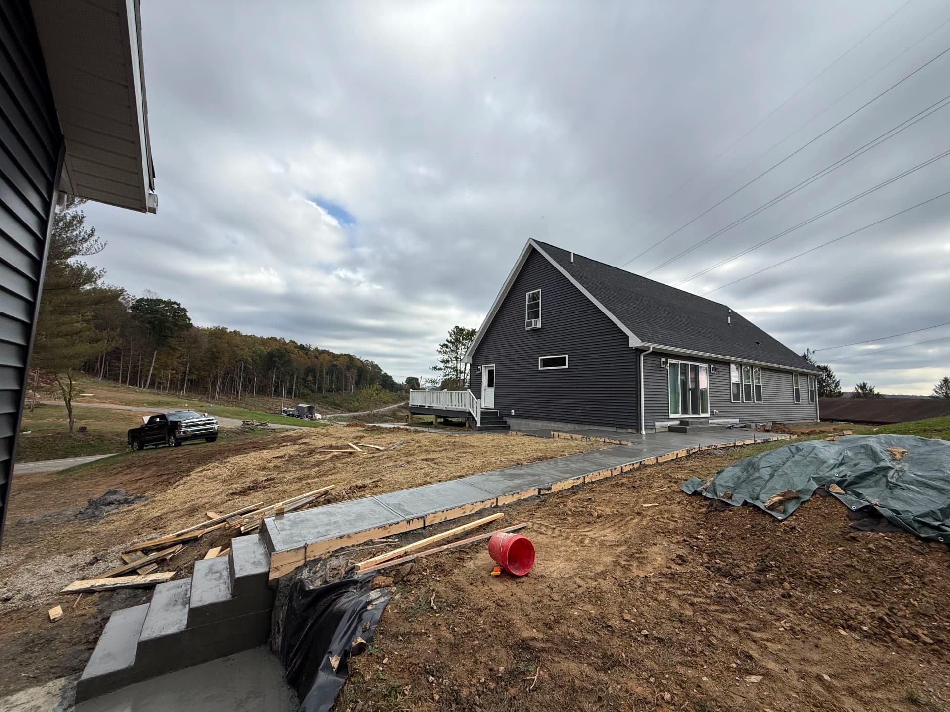 Concrete Sidewalk and Patio Installation on a New Home Build image