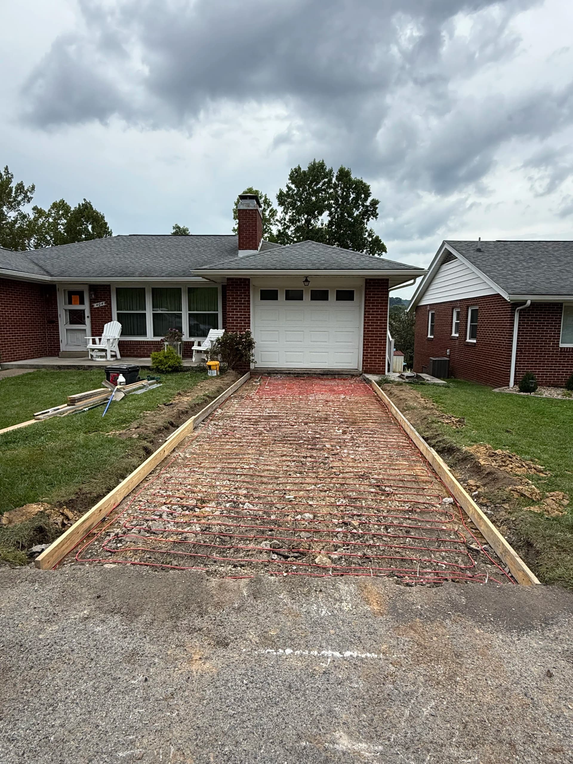 Gallery photos for Cracked Asphalt Out, Heated Concrete Driveway In: Image #1