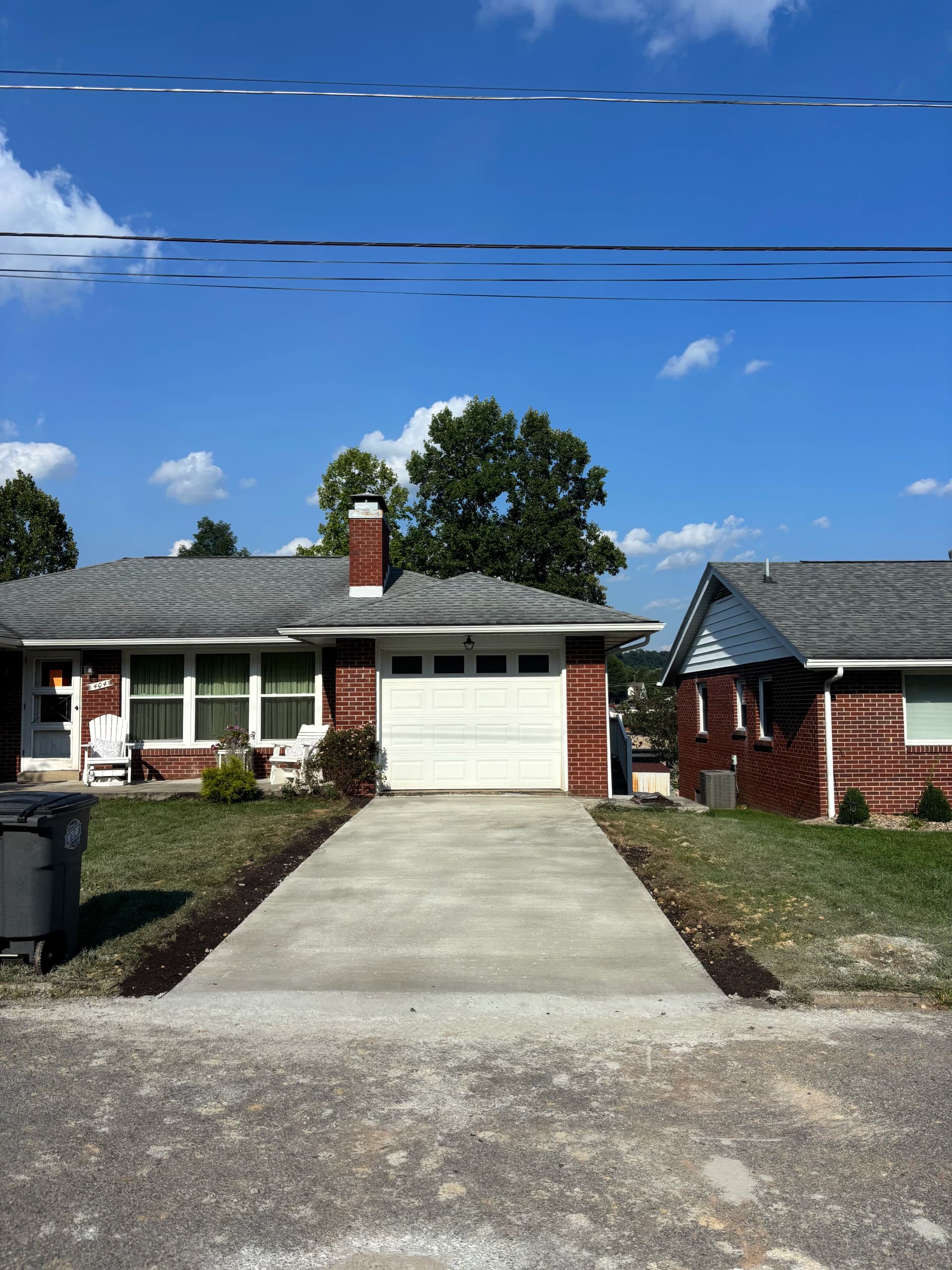 Cracked Asphalt Out, Heated Concrete Driveway In image