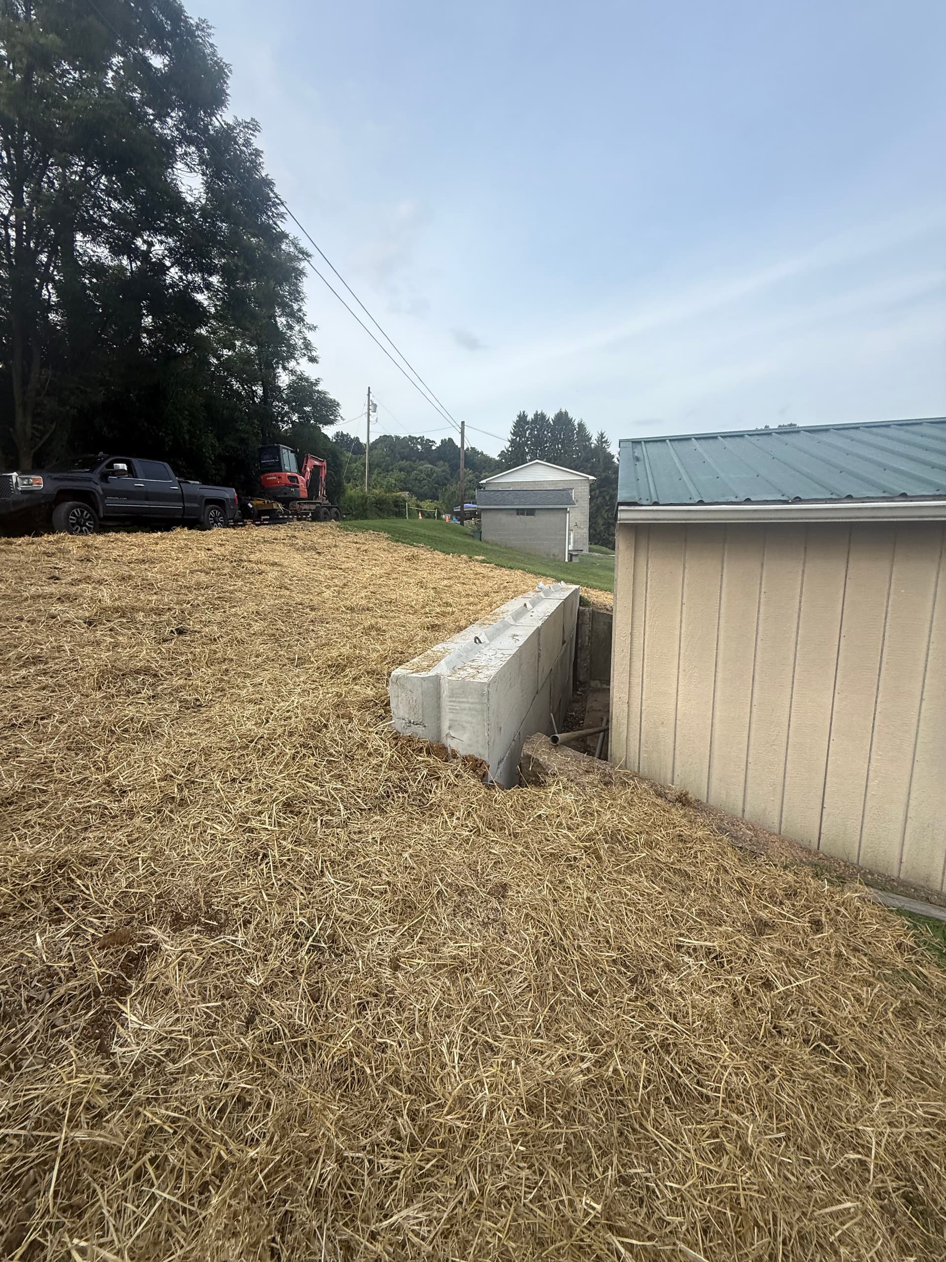 When a Leaning Retaining Wall Gets the Fix It Actually Needs